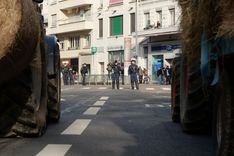 Despite a heavy police presence, the demonstration happened peacefully, and police even helped move cars out of the way for the farmers' tractors to pass through narrow streets.