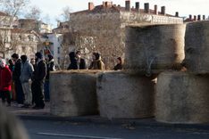 The farmers blocked the pont Wilson, one of Lyon's main bridges, and built a pyramid from hay in protest.